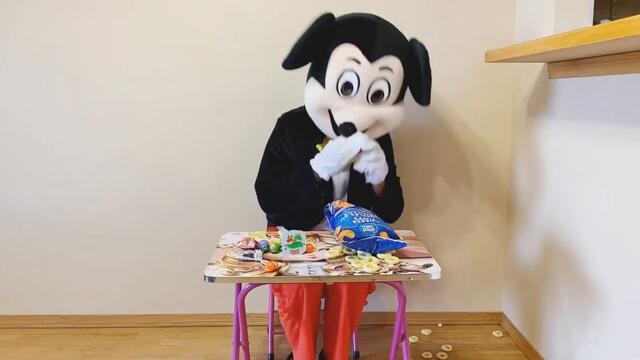 Mickey Mouse eating junk food