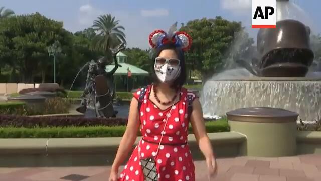 Mickey Mouse welcomes visitors back as park reopens
