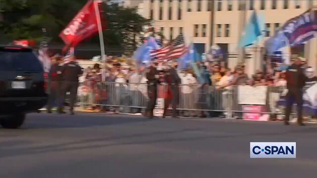 President Trump drives by supporters outside Walter Reed Medical Center.