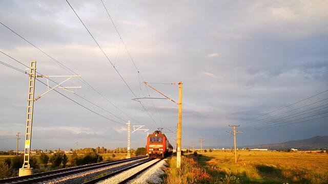 BDZ Passenger Train with DB Schenker locomotive entering Iskar Train station in Bulgaria