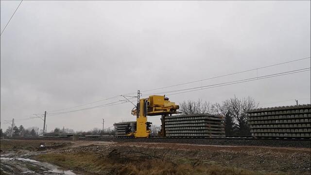 Railway Sleeper Laying Machine at work nearby Iskar Train Station in Bulgaria