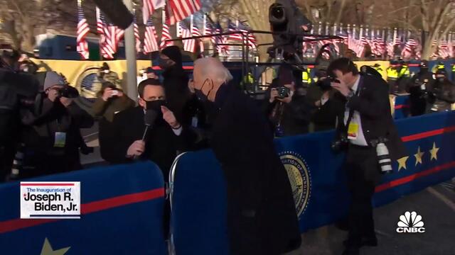 President Joe Biden walks toward the White House