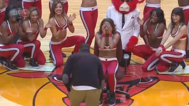 Guy comes out of Benny the Bull costume to propose to Bulls dancer 12-5-13
